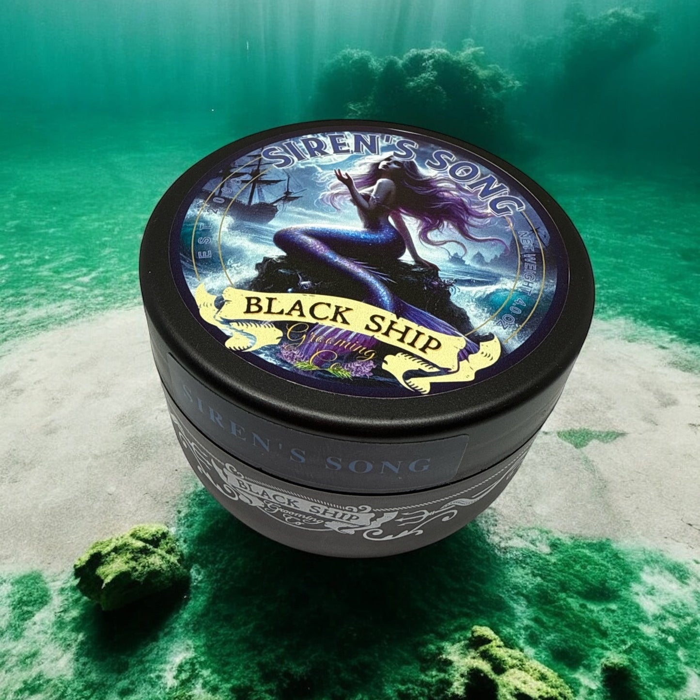 Jar of 'Siren's Song Black Ship' Shaving soap on a green underwater background