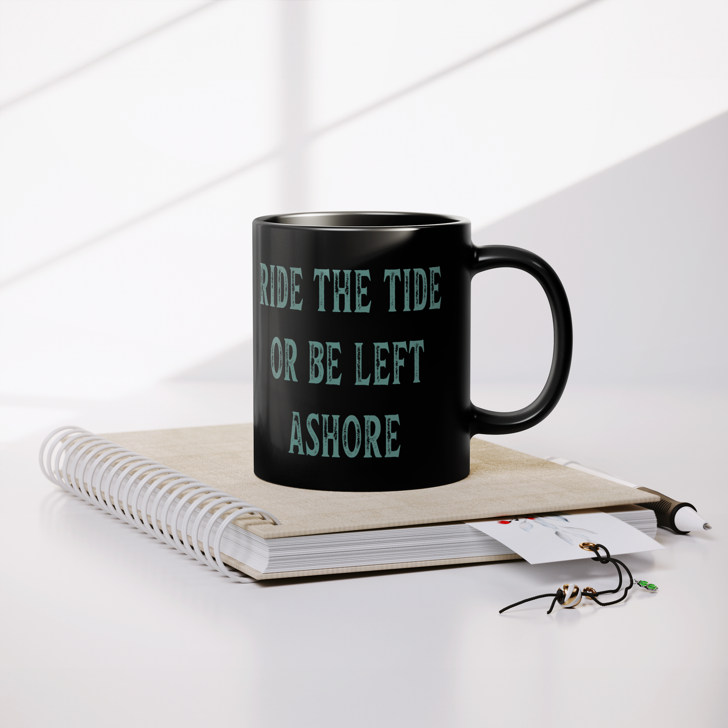 Black_Tide_11oz_Ceramic_Mug__Sip_the__Lifestyle_Notebook_Mockup.png